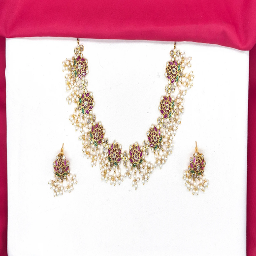 Beautifully designed with Lotus flowers and Guttapusalu clustered pearls Short Haram